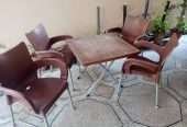Used Out Door Plastic Chairs and Table Set Brown
