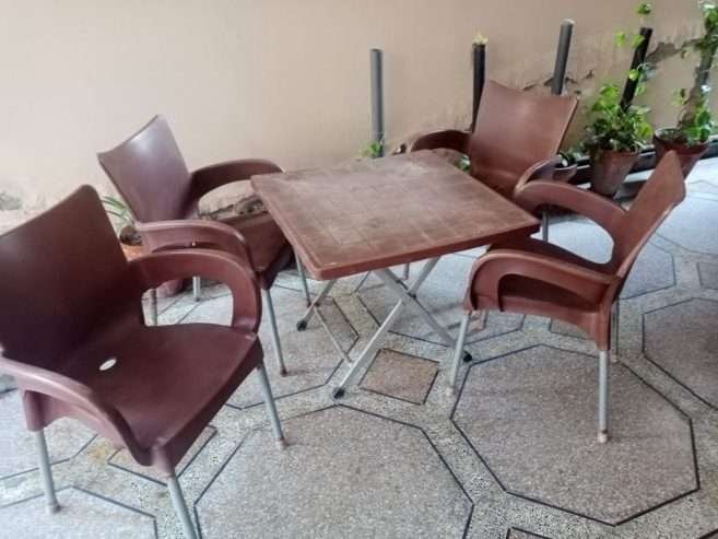 Used Out Door Plastic Chairs and Table Set Brown