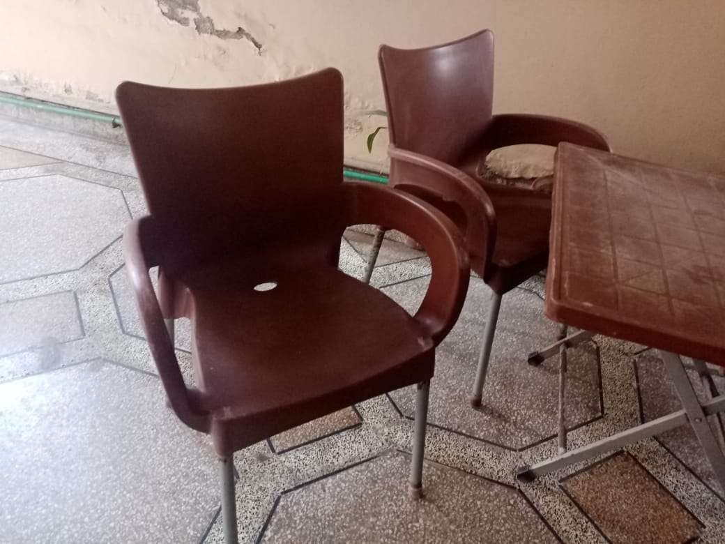 Used Out Door Plastic Chairs and Table Set Brown