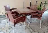Used Out Door Plastic Chairs and Table Set Brown
