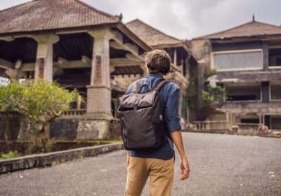 imgi_98_131159912-man-tourist-in-abandoned-and-mysterious-hotel-in-bedugul-indonesia-bali-island-bali-travel